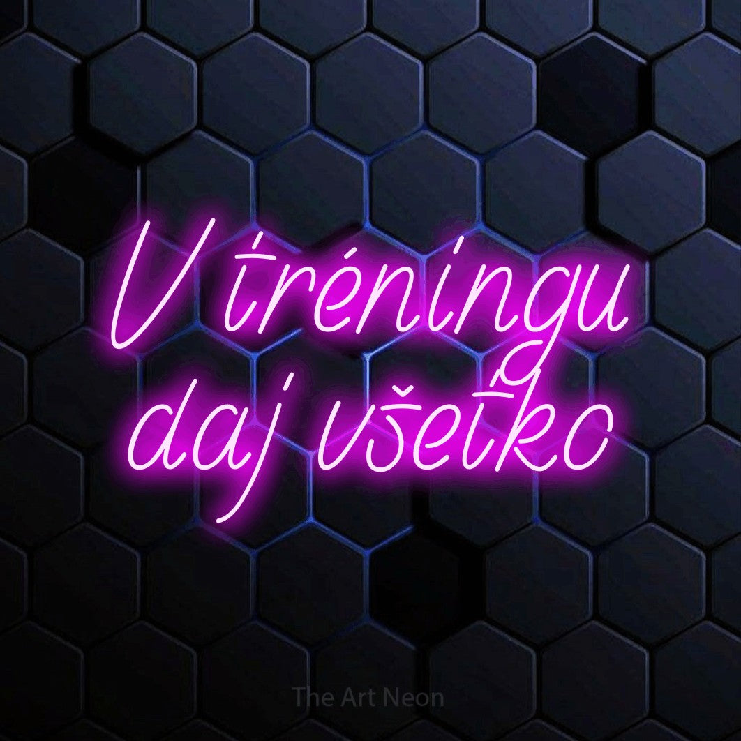 LED neon sign reading “V tréningu daj všetko”, arranged in two lines.