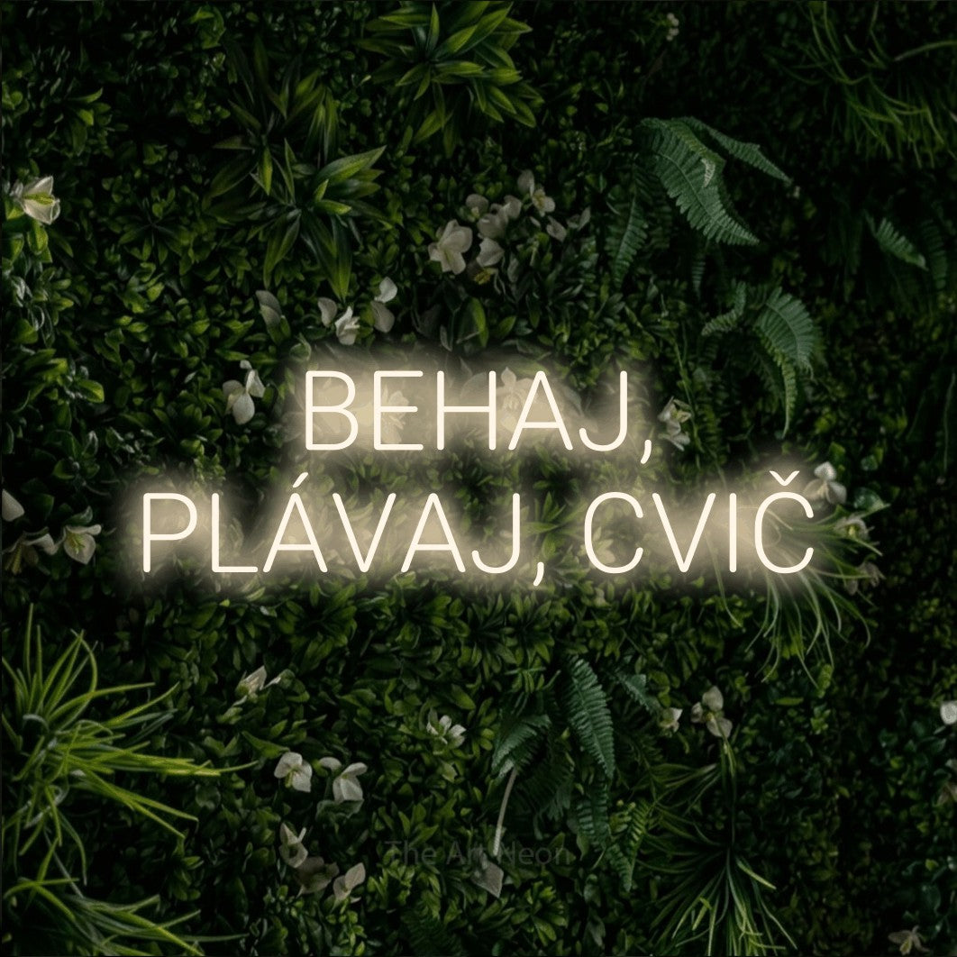 LED neon sign reading “BEHAJ, PLÁVAJ, CVIČ”, arranged in two lines.