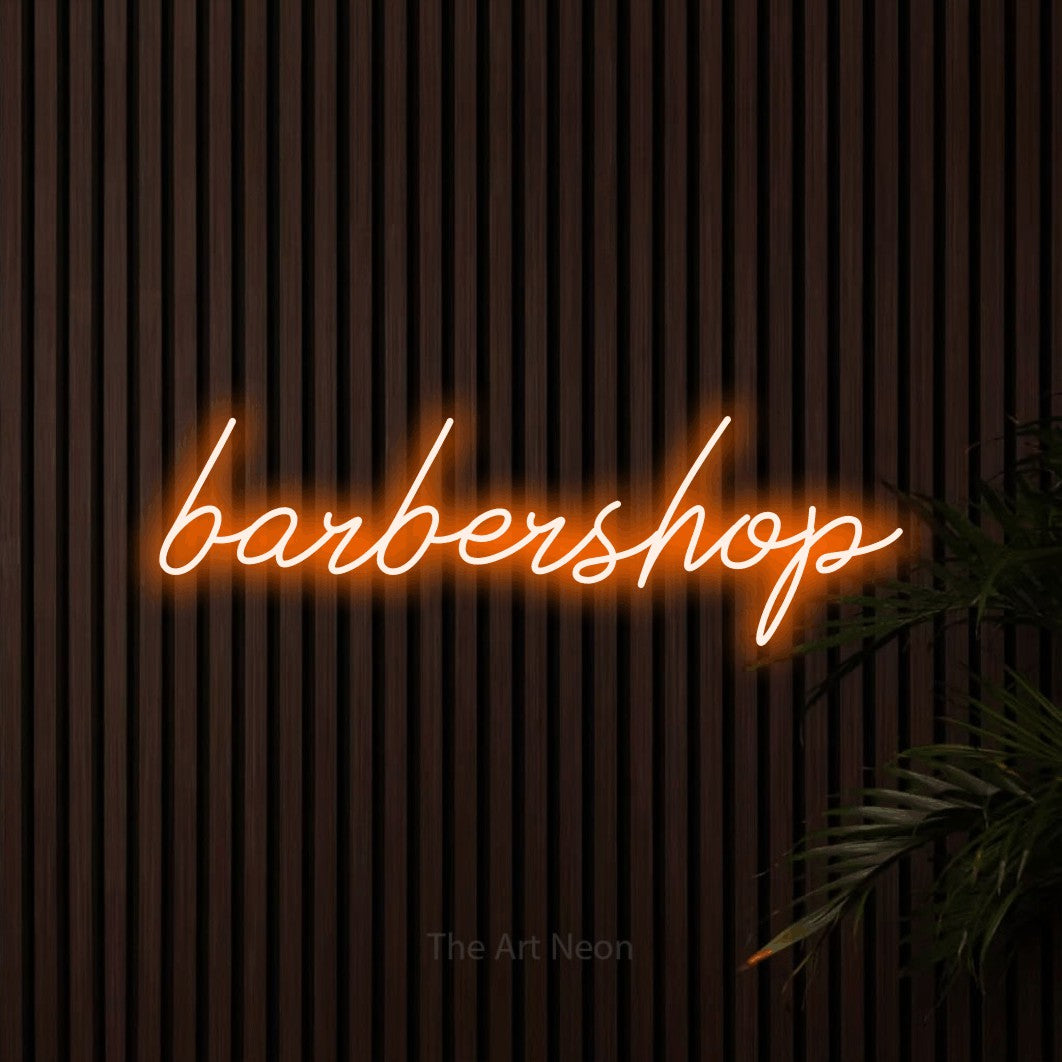 LED neon sign reading “barbershop”, arranged in a single line.