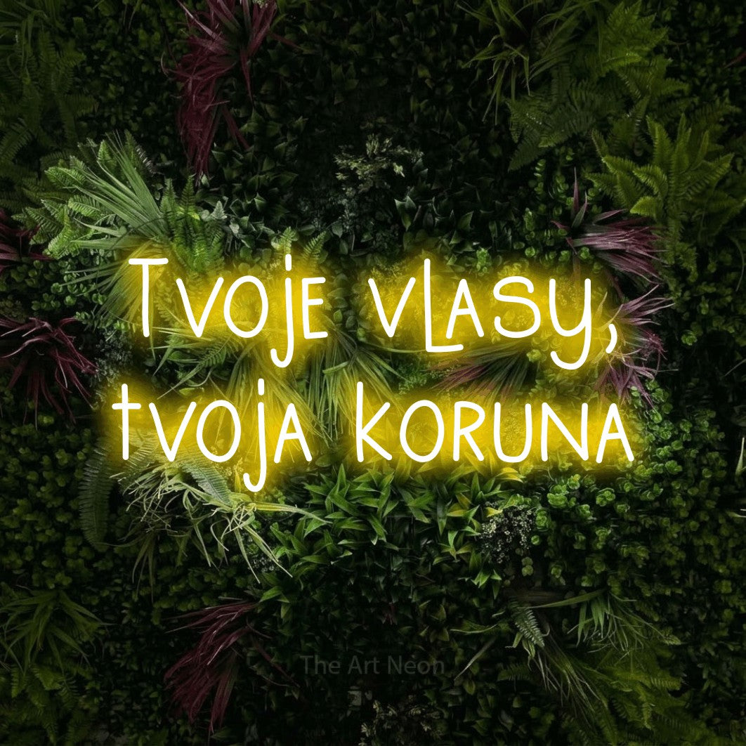 LED neon sign reading “Tvoje vlasy, tvoja koruna”, arranged in two lines.