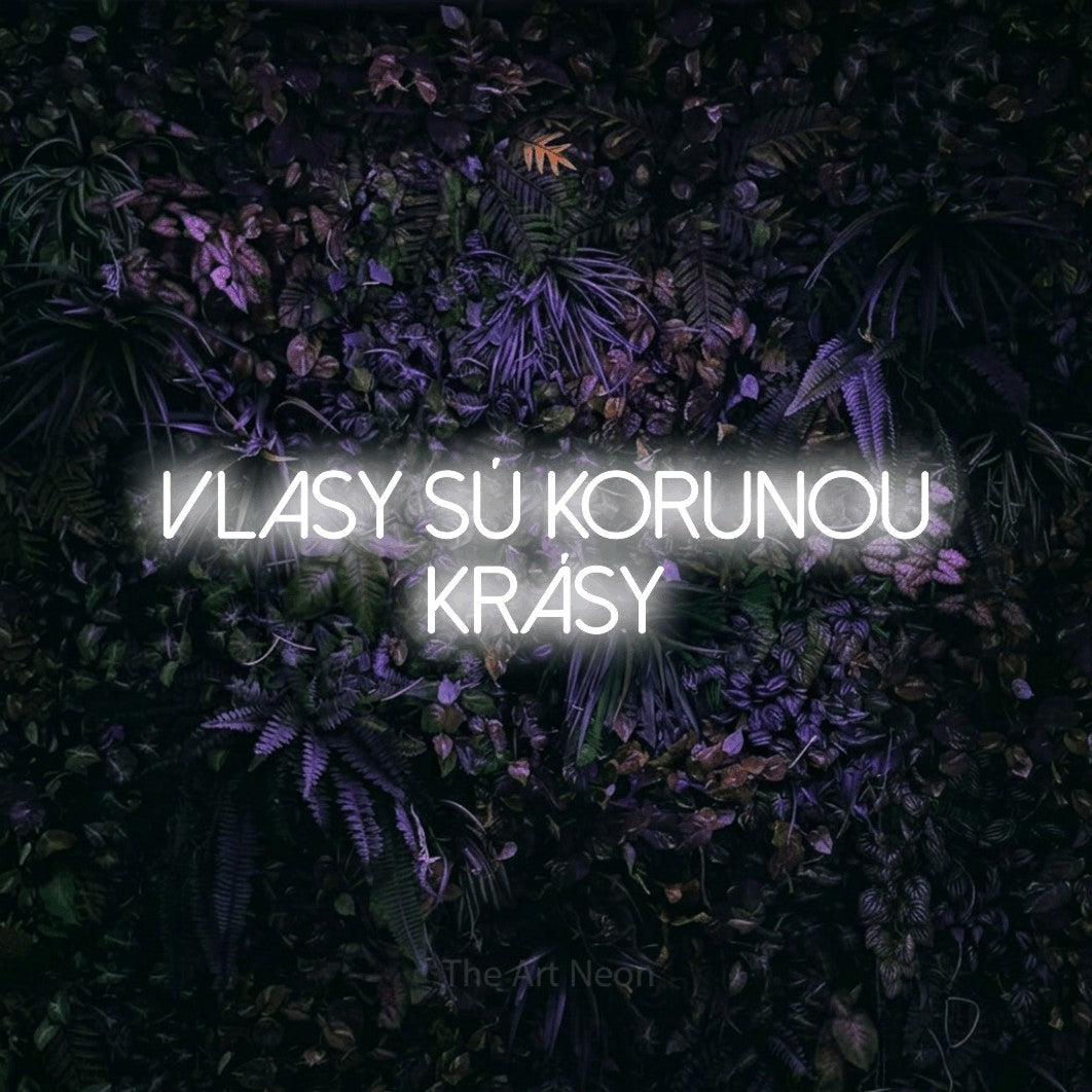 LED neon sign reading “vlasy sú korunou KRÁSY”, arranged in two lines.