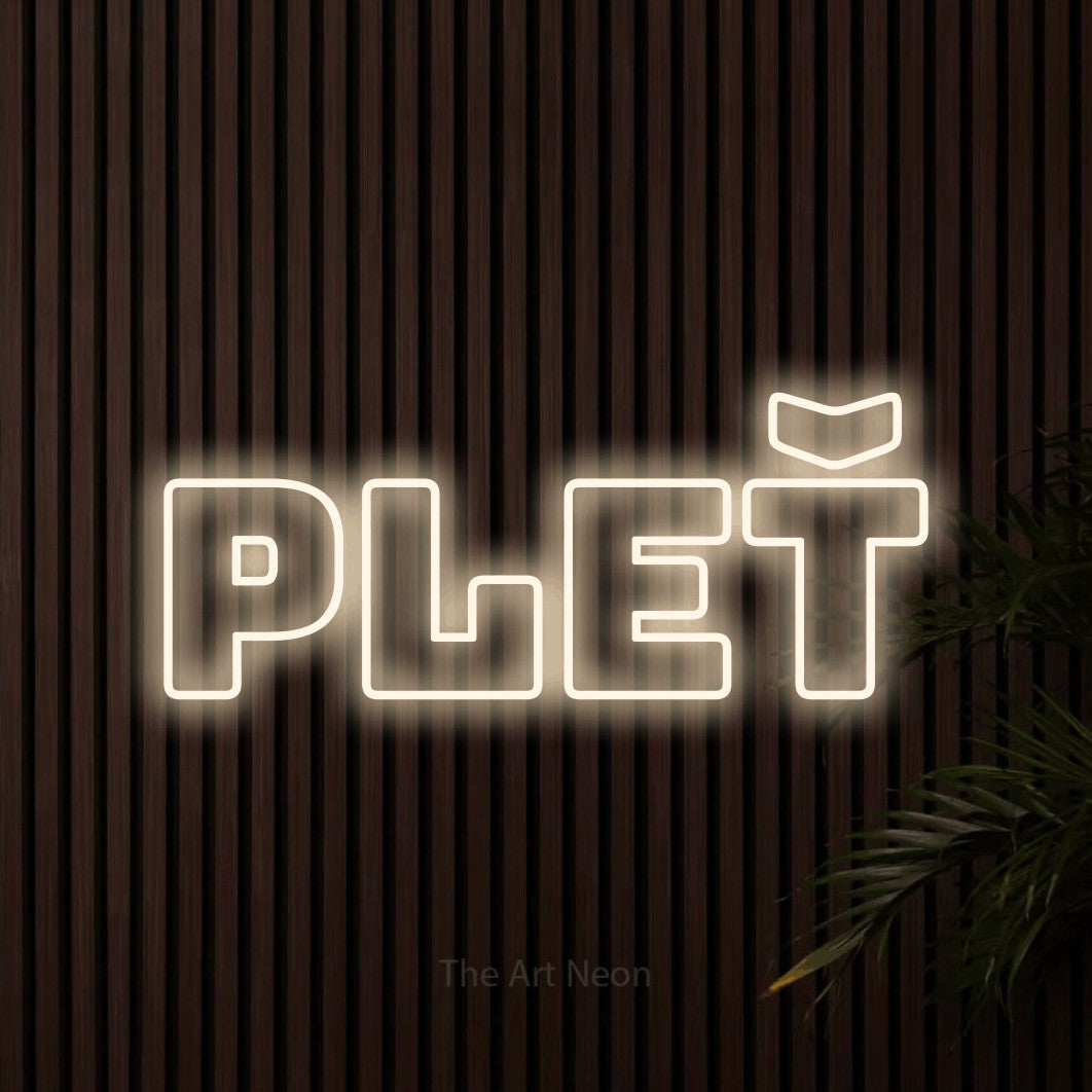 LED neon sign reading “pleť”, arranged in a single line.