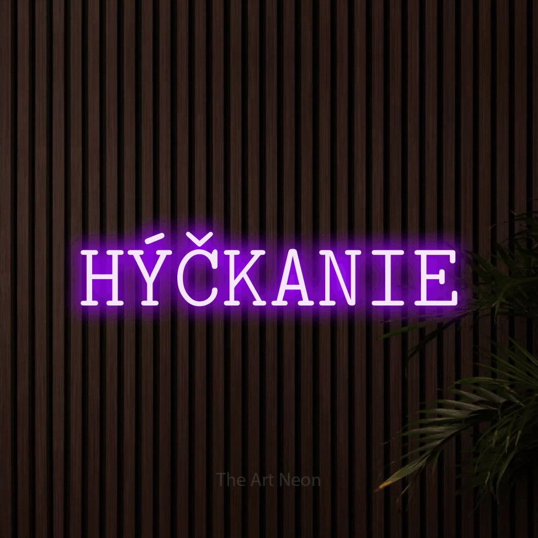 LED neon sign reading “HÝČKANIE”, arranged in a single line.