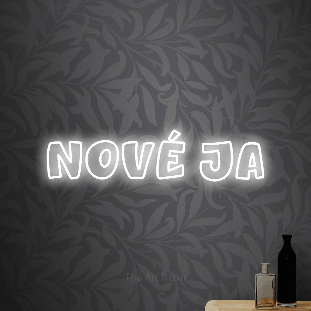 LED neon sign reading “NOVÉ JA”, arranged in a single line.