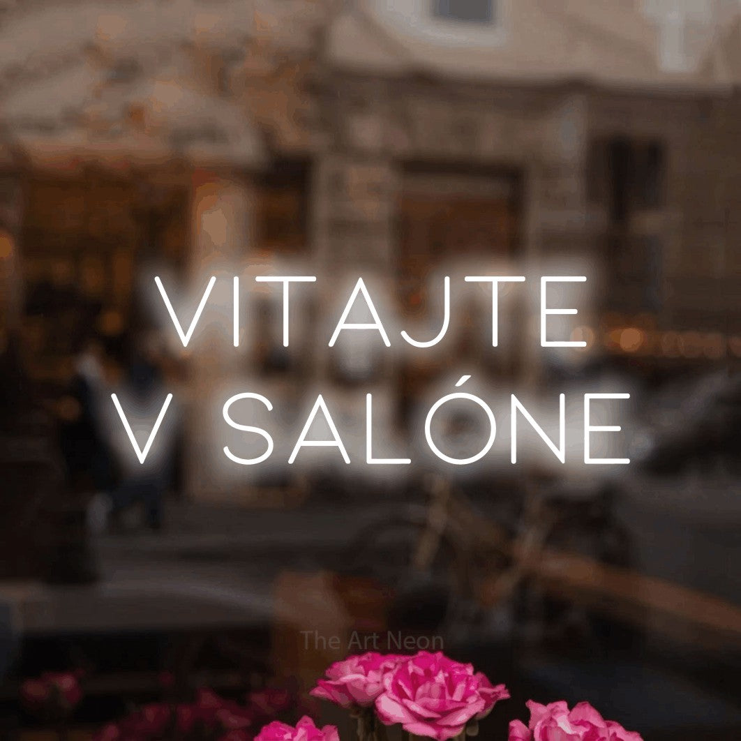 LED neon sign reading “vitajte v salóne”, arranged in two lines.