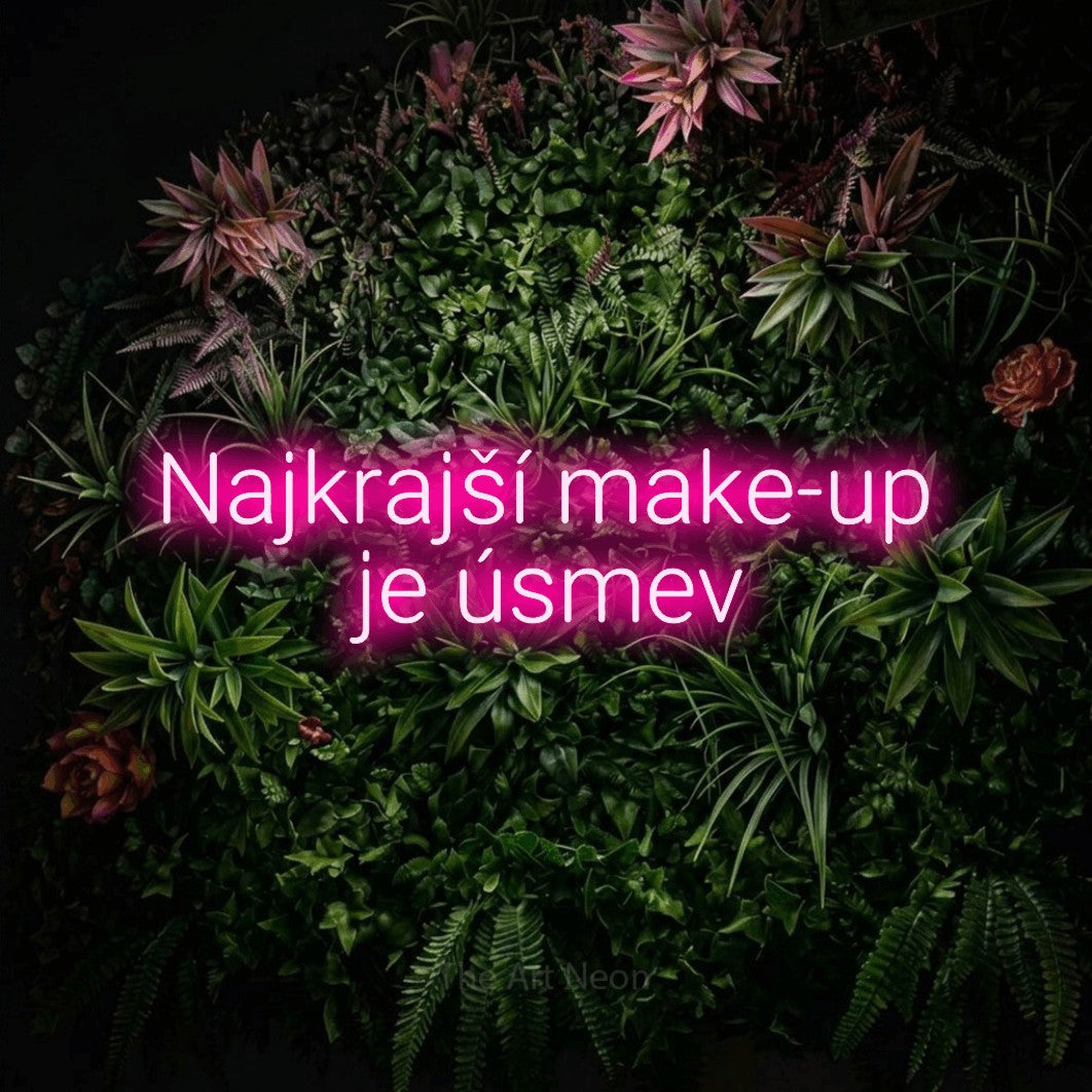 LED neon sign reading “Najkrajší make-up je úsmev”, arranged in two lines.