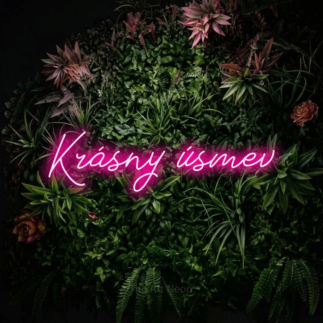 LED neon sign reading “Krásny úsmev”, arranged in a single line.