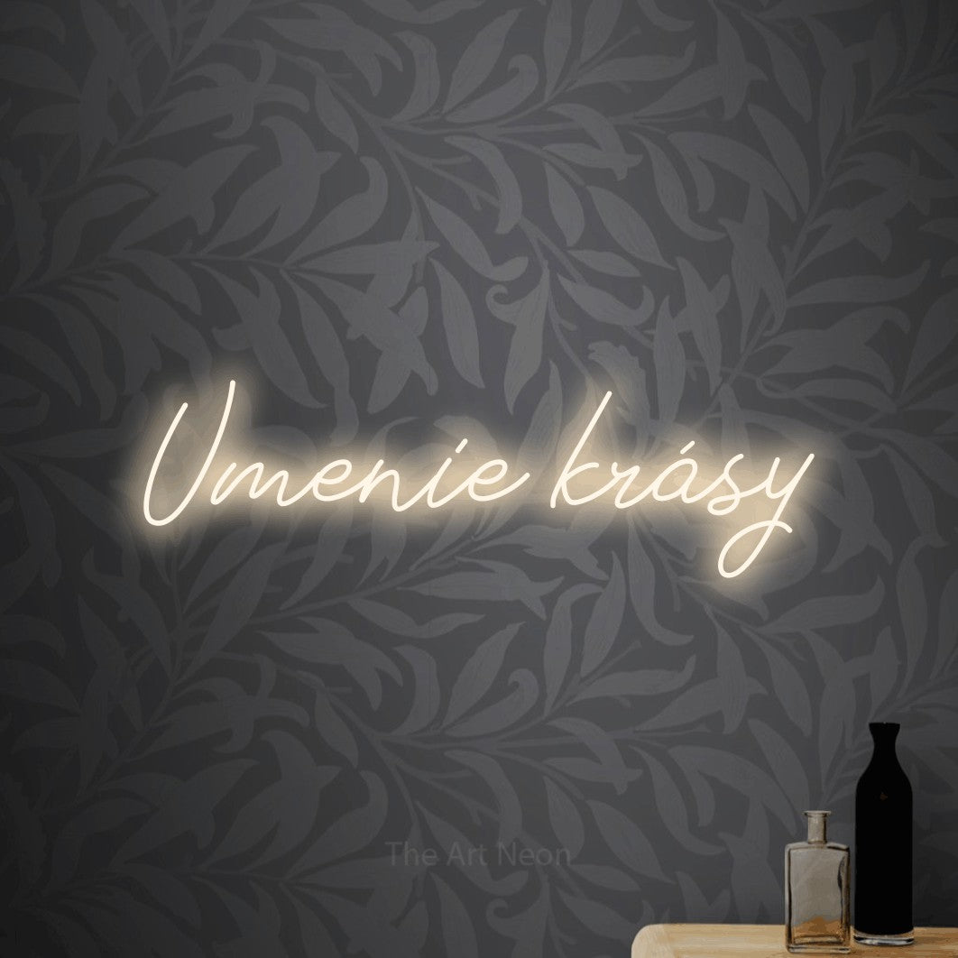 LED neon sign reading “Umenie krásy”, arranged in a single line.