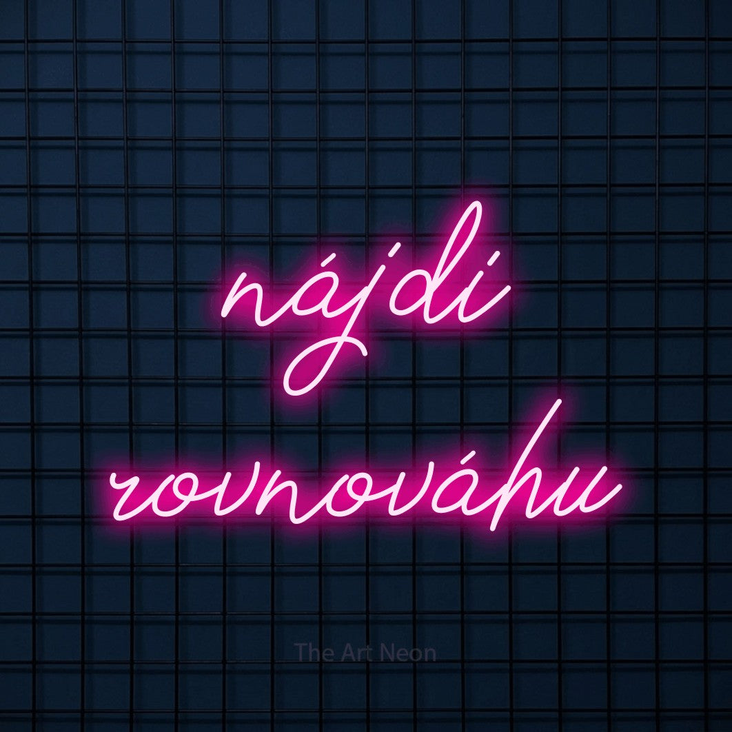 LED neon sign reading “nájdi rovnováhu”, arranged in two lines.