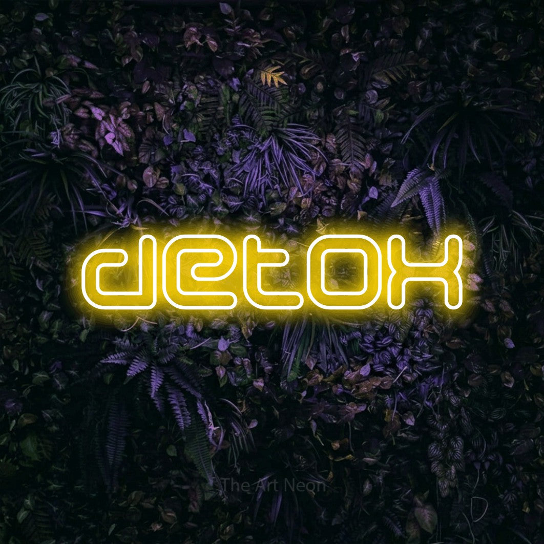 LED neon sign reading “detox”, arranged in a single line.