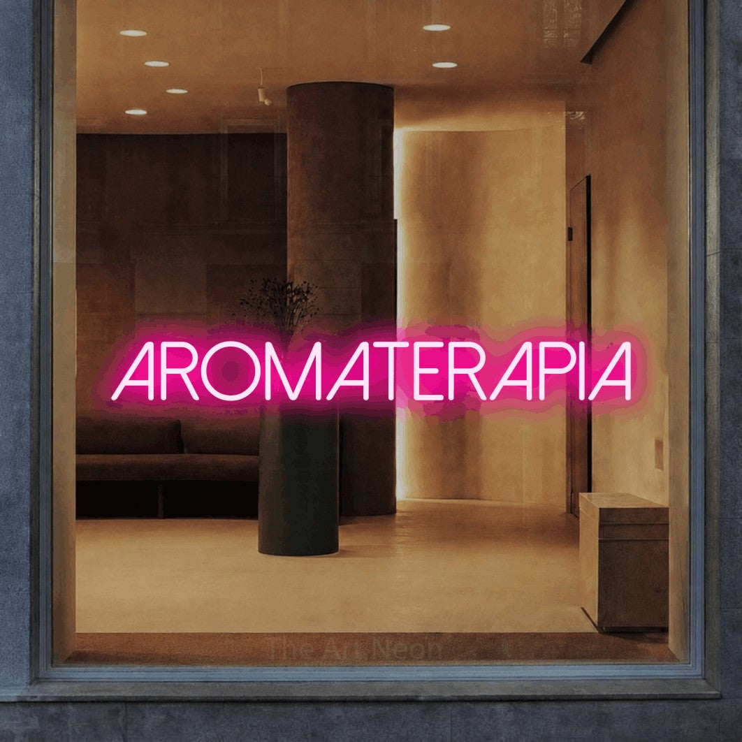 LED neon sign reading “aromaterapia”, arranged in a single line.