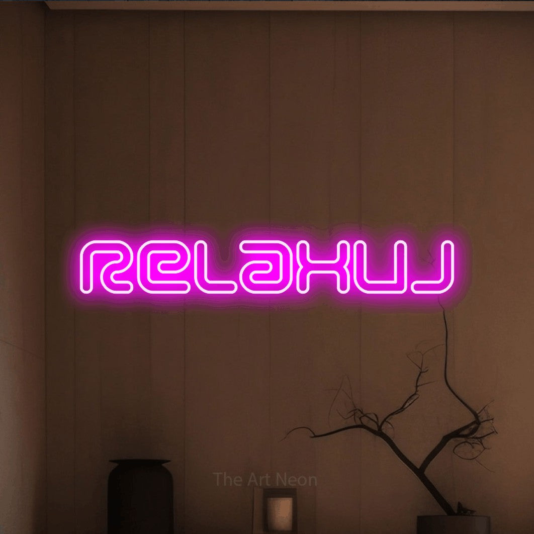 LED neon sign reading “Relaxuj”, arranged in a single line.