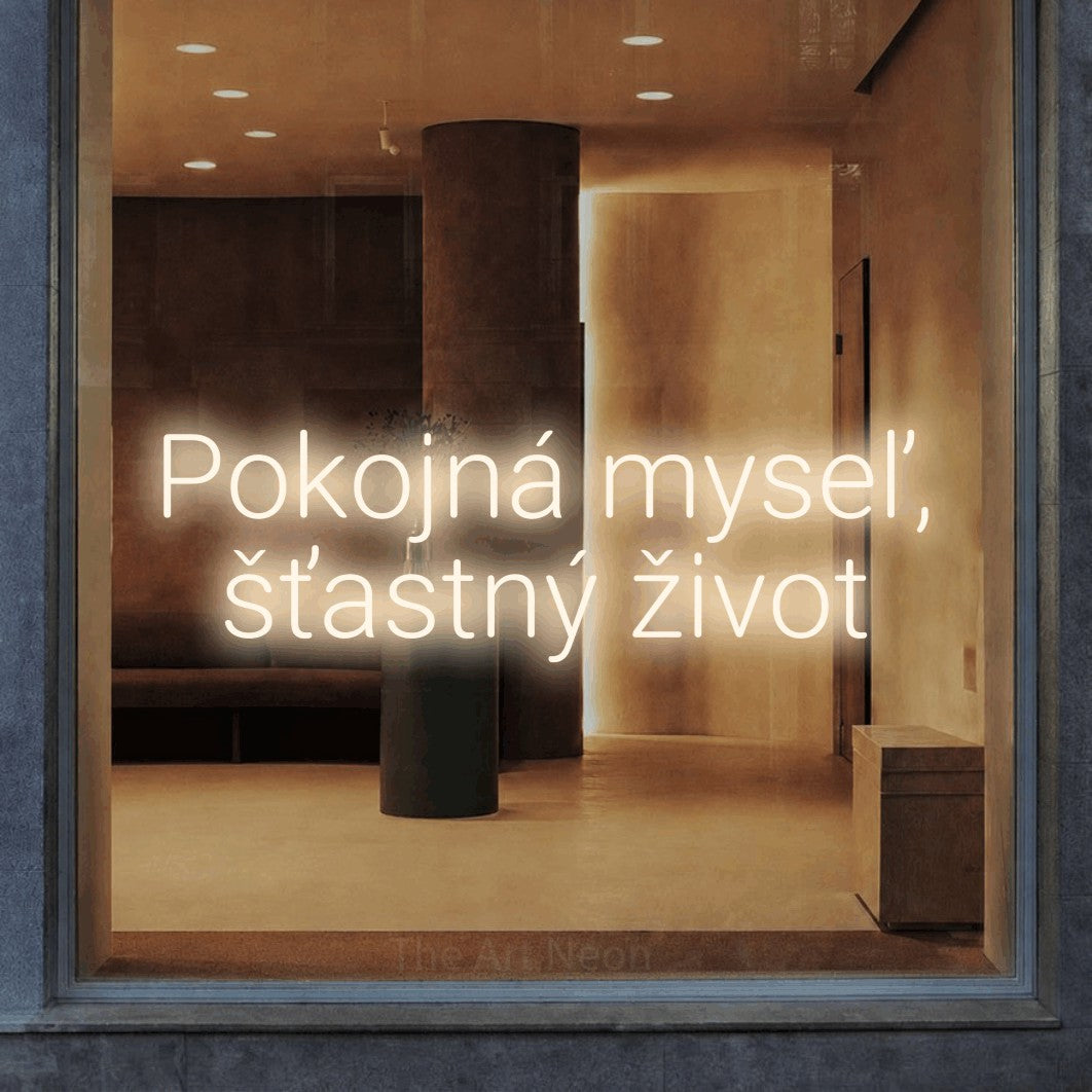 LED neon sign reading “Pokojná myseľ, šťastný život”, arranged in two lines.