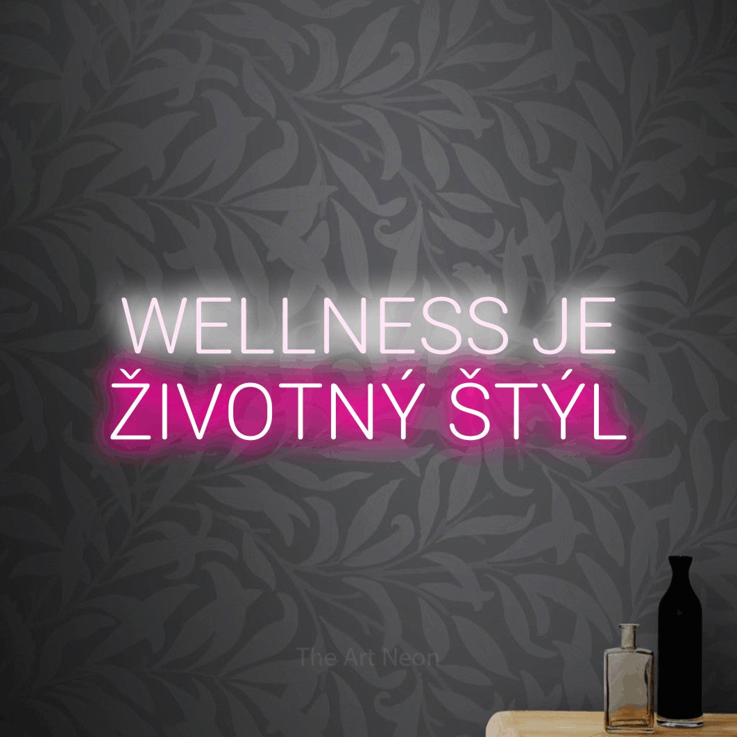 LED neon sign reading “WELLNESS JE ŽIVOTNÝ ŠTÝL”, arranged in two lines.