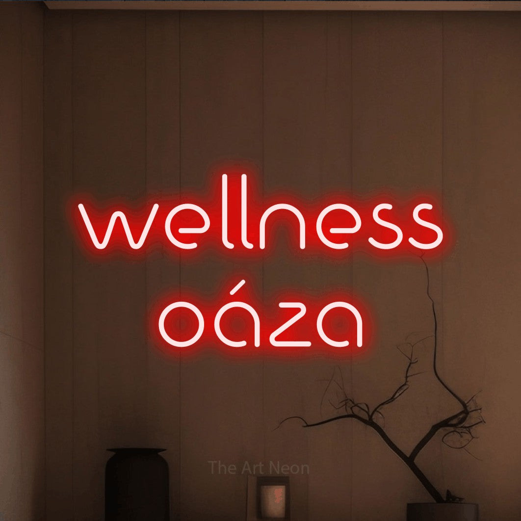 LED neon sign reading “wellness oáza”, arranged in two lines.