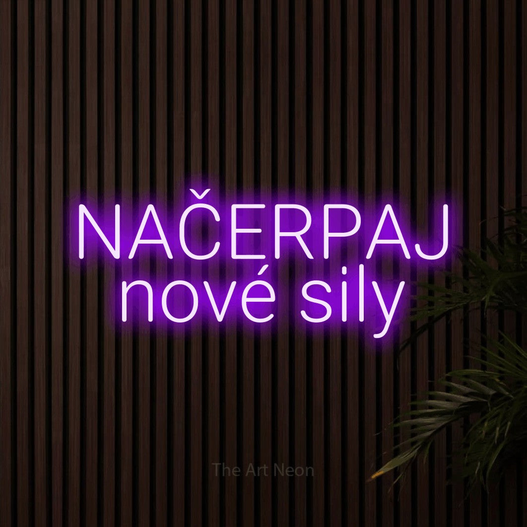 LED neon sign reading “NAČERPAJ nové sily”, arranged in two lines.