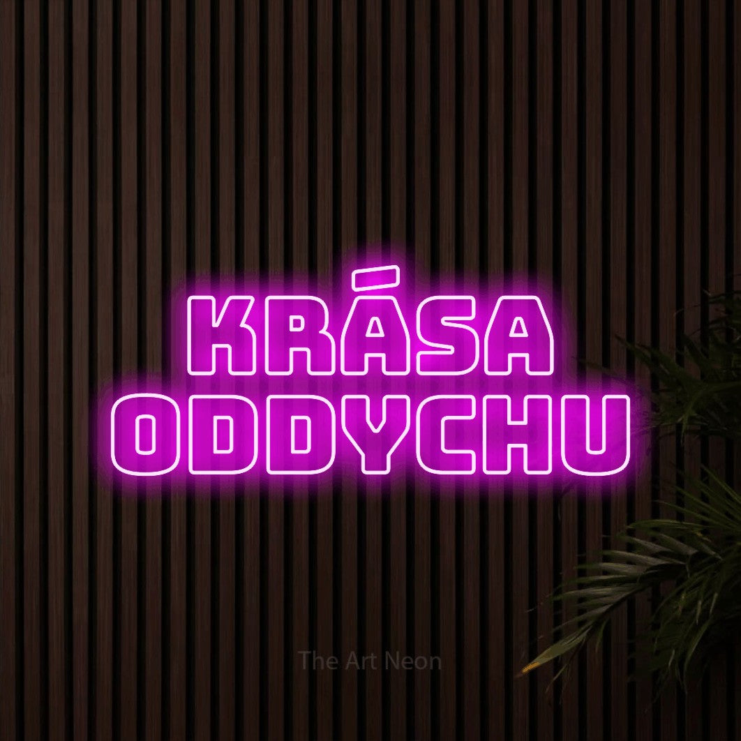 LED neon sign reading “KRÁSA ODDYCHU”, arranged in two lines.