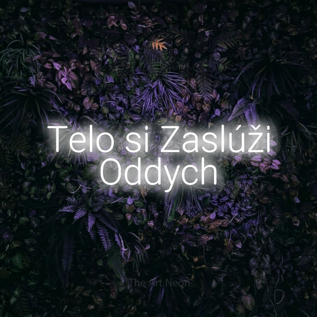 LED neon sign reading “Telo si Zaslúži Oddych”, arranged in two lines.