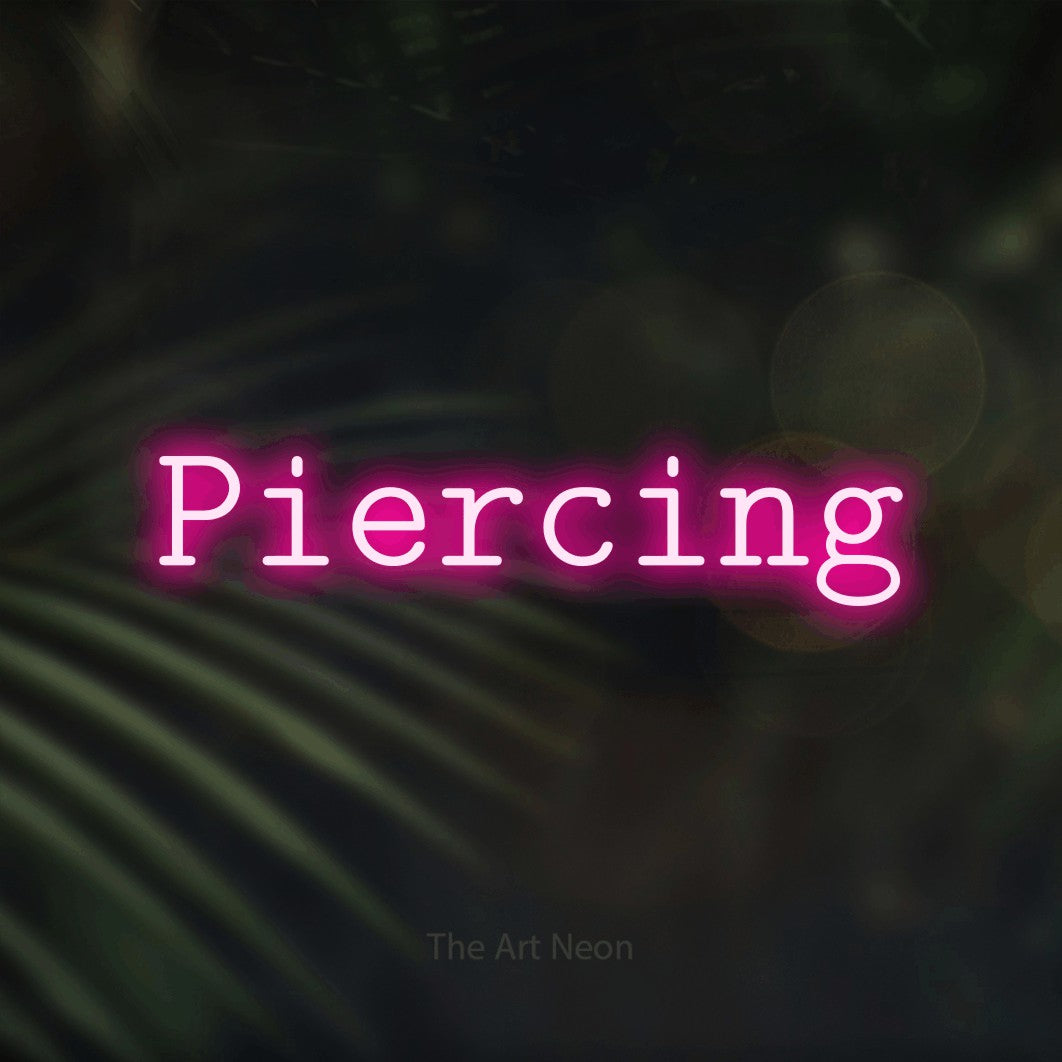 LED neon sign reading “Piercing”, arranged in a single line.
