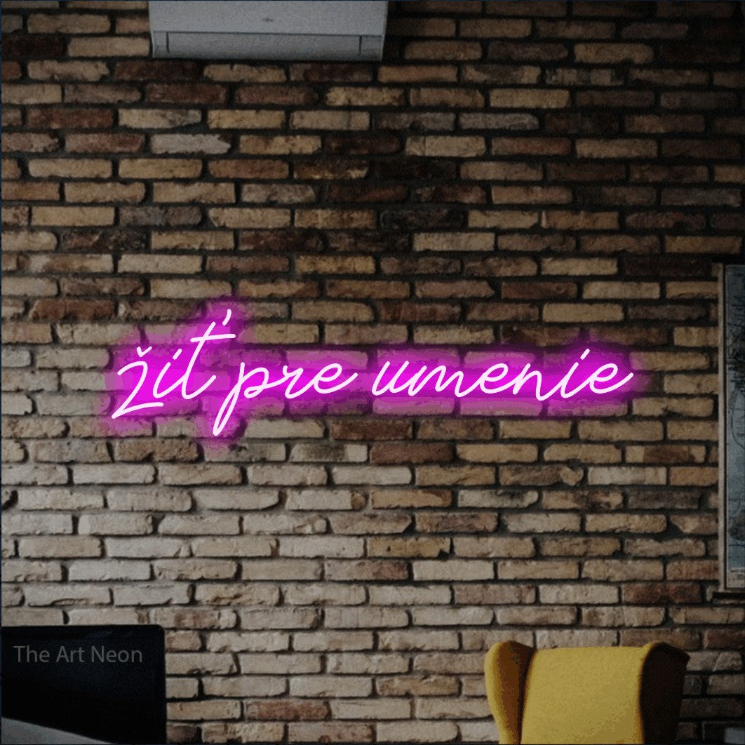 LED neon sign reading “žiť pre umenie”, arranged in a single line.
