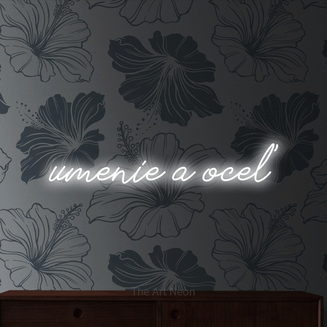 LED neon sign reading “umenie a oceľ”, arranged in a single line.
