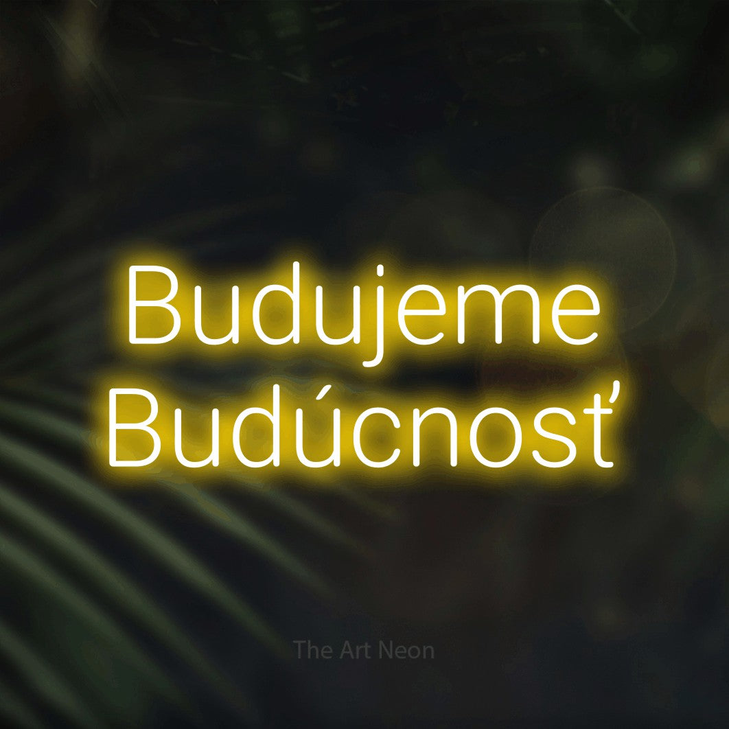LED neon sign reading “Budujeme Budúcnosť”, arranged in two lines.