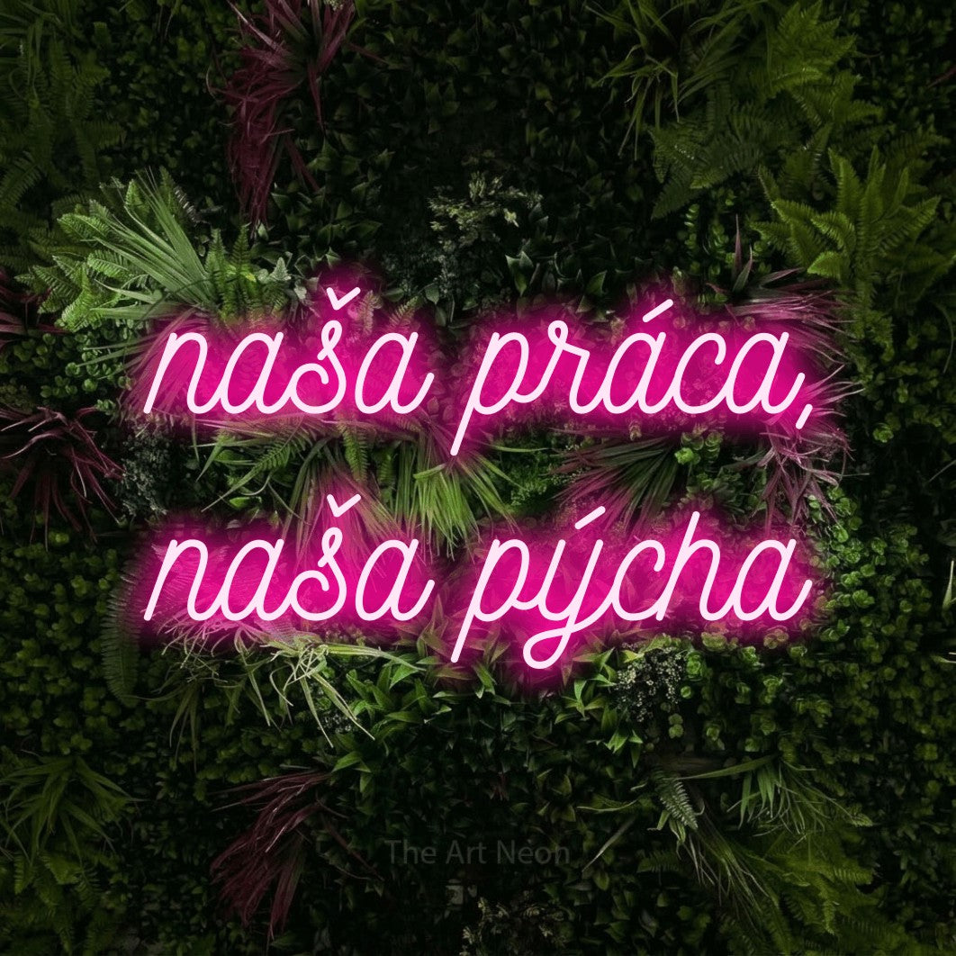 LED neon sign reading “naša práca, naša pýcha”, arranged in two lines.