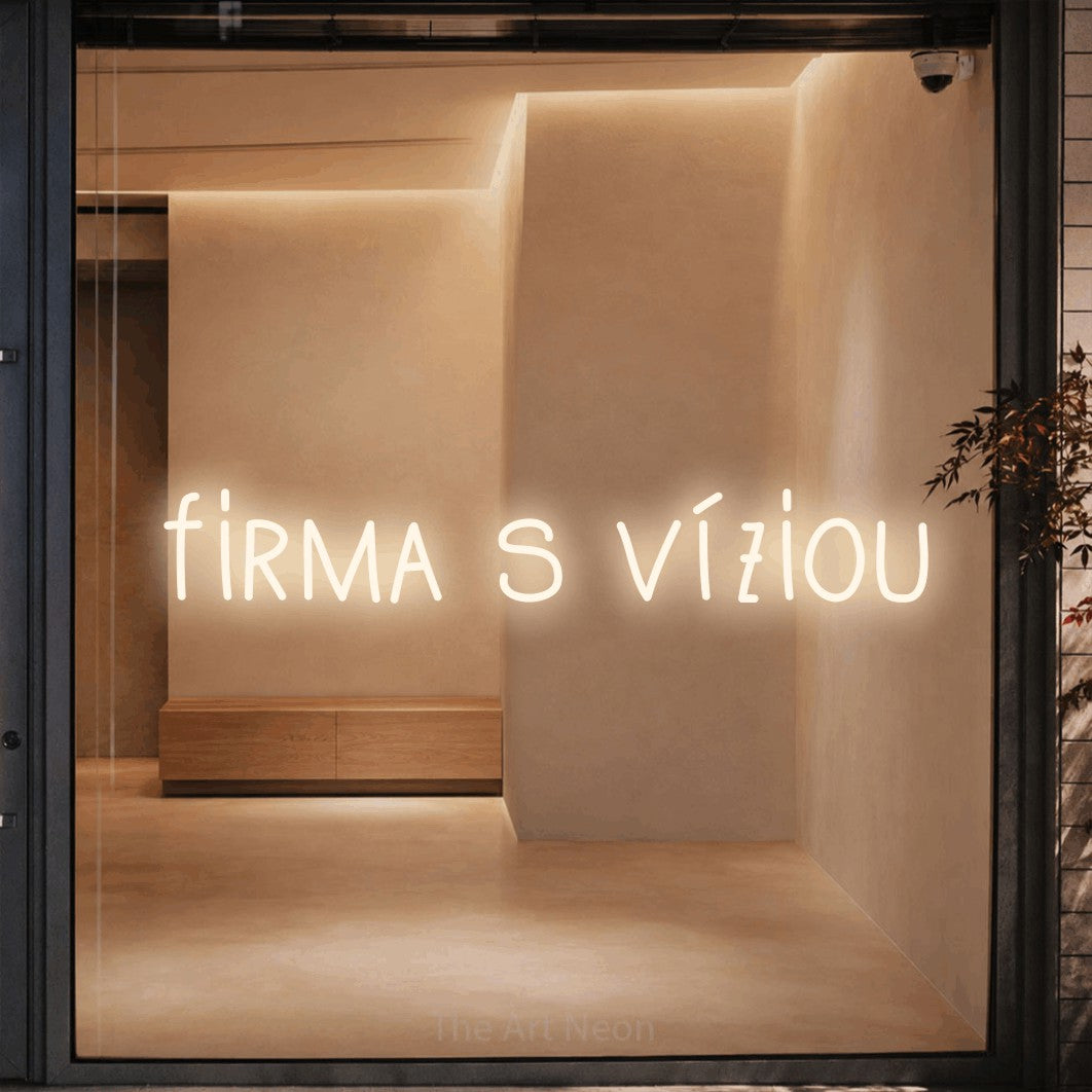 LED neon sign reading “firma s víziou”, arranged in a single line.