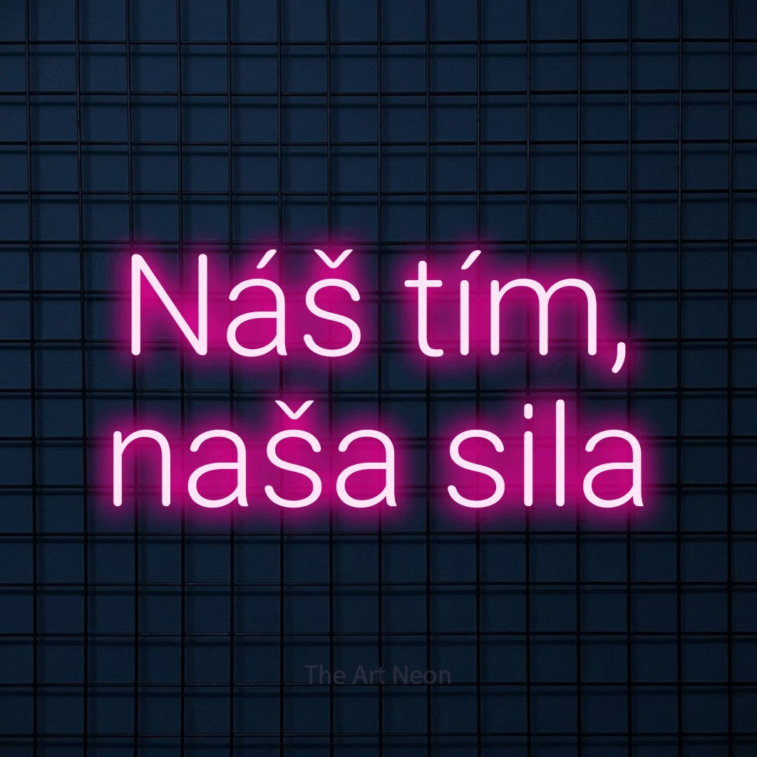 LED neon sign reading “Náš tím, naša sila”, arranged in two lines.