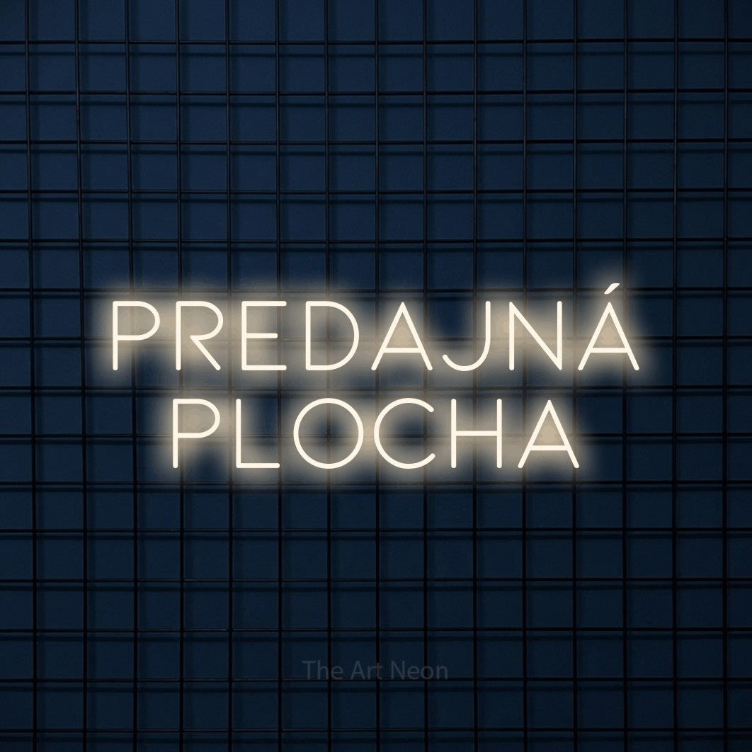 LED neon sign reading “PREDAJNÁ PLOCHA”, arranged in two lines.