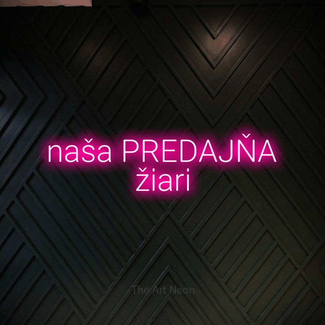 LED neon sign reading “naša PREDAJŇA žiari”, arranged in two lines.