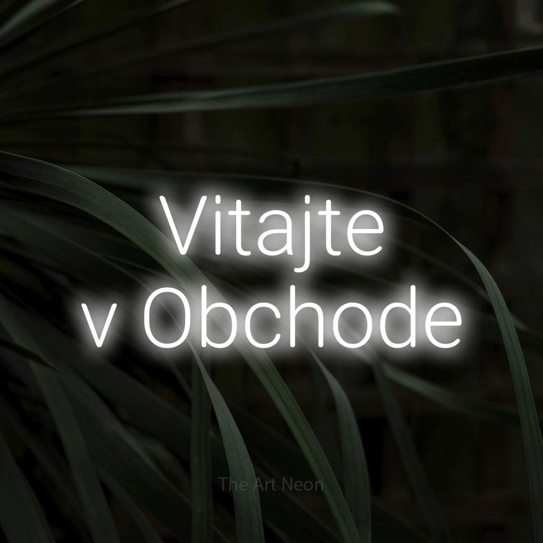 LED neon sign reading “Vitajte v Obchode”, arranged in two lines.