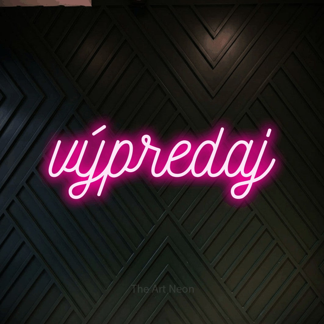 LED neon sign reading “výpredaj”, arranged in a single line.