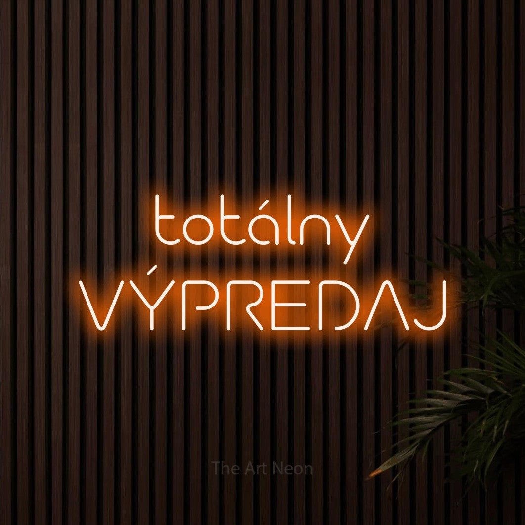 LED neon sign reading “totálny VÝPREDAJ”, arranged in two lines.