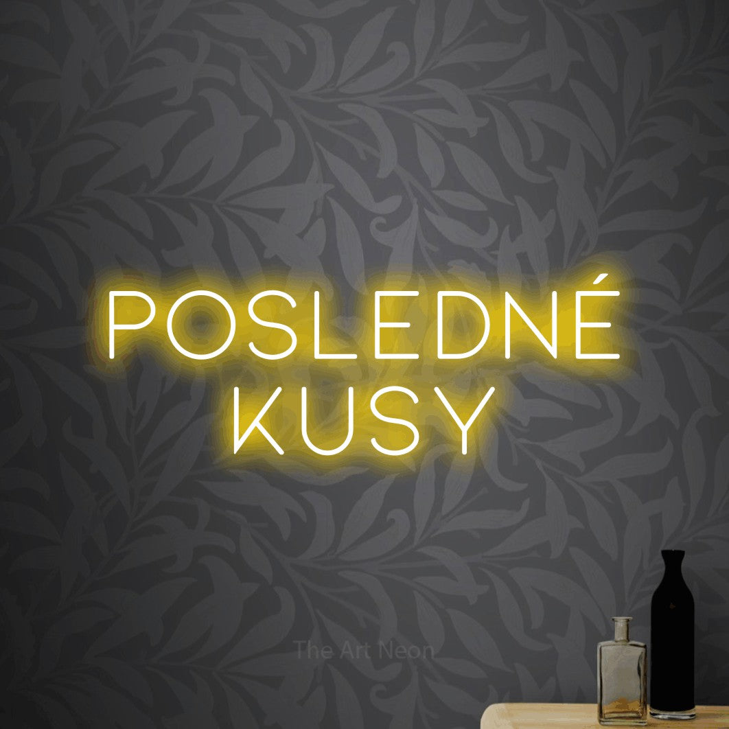 LED neon sign reading “POSLEDNÉ kusy”, arranged in two lines.