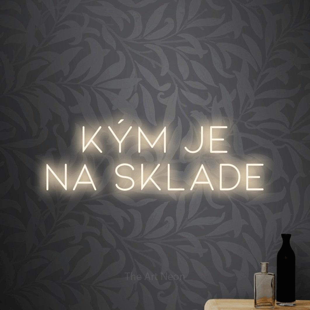 LED neon sign reading “kým je NA SKLADE”, arranged in two lines.