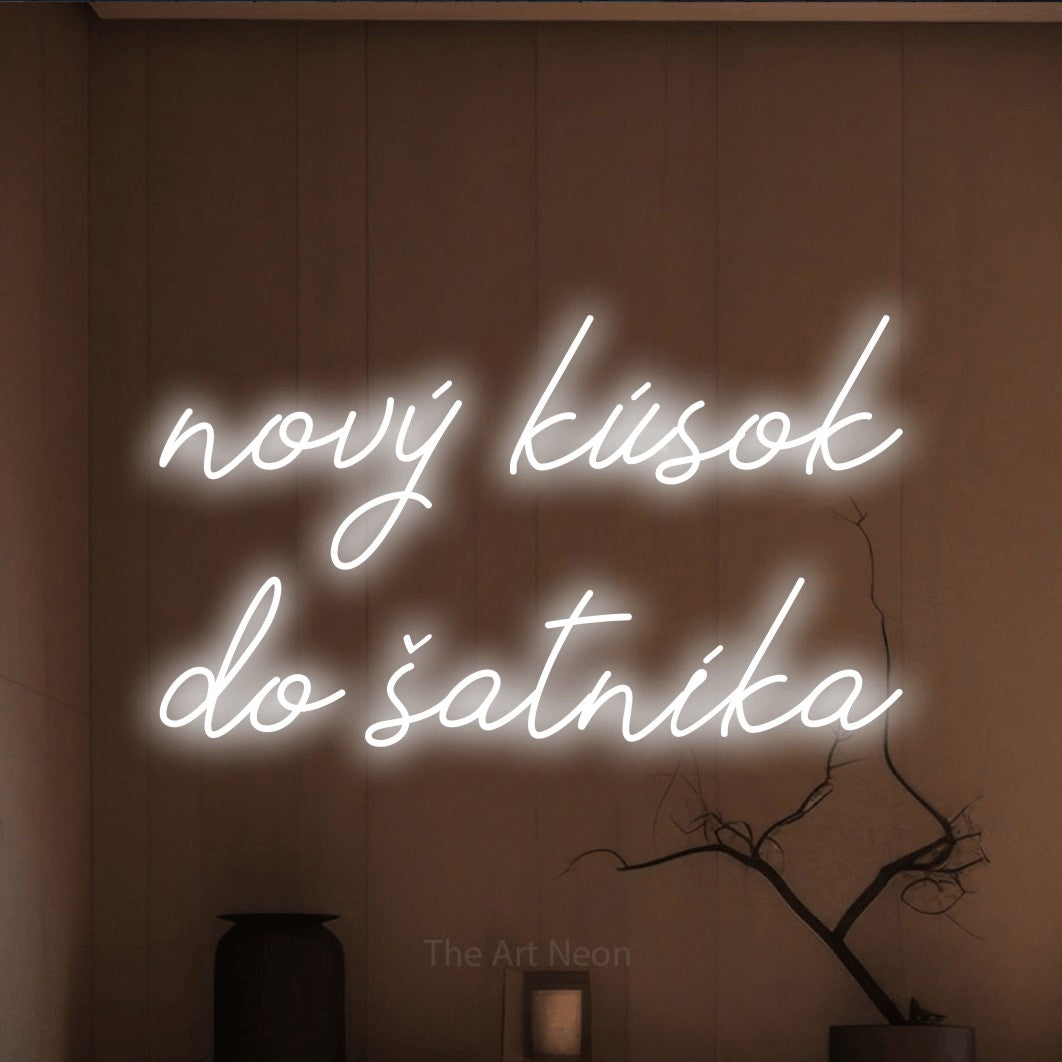LED neon sign reading “nový kúsok do šatníka”, arranged in two lines.