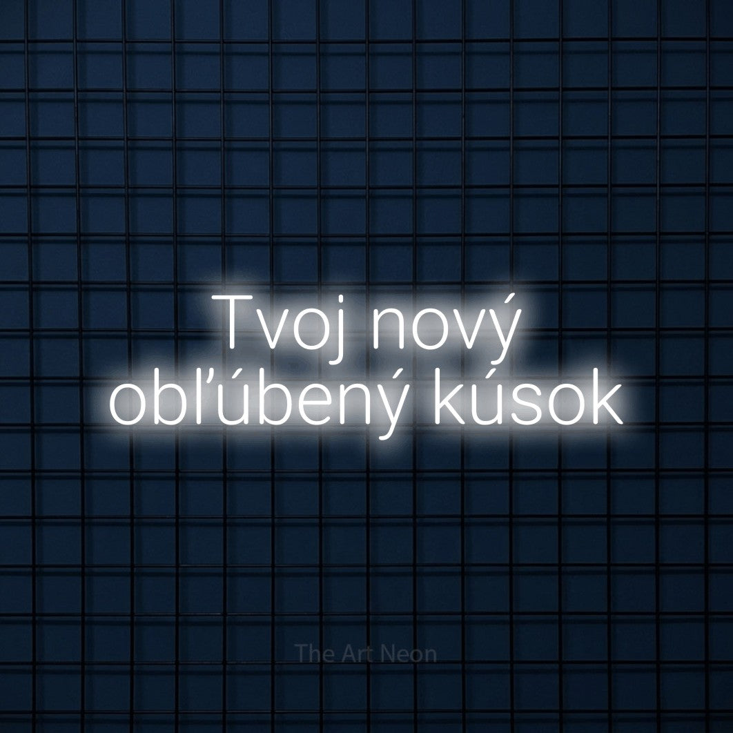 LED neon sign reading “Tvoj nový obľúbený kúsok”, arranged in two lines.