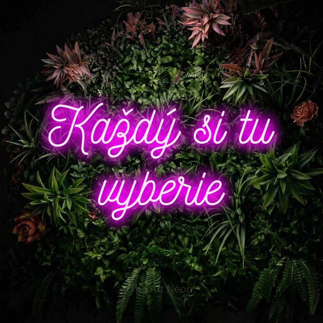 LED neon sign reading “Každý si tu vyberie”, arranged in two lines.