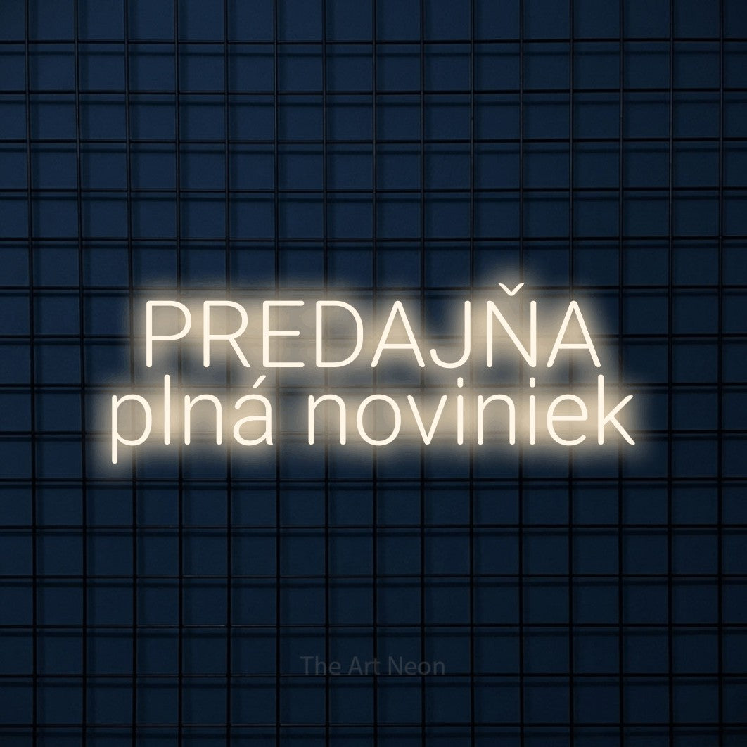 LED neon sign reading “PREDAJŇA plná noviniek”, arranged in two lines.