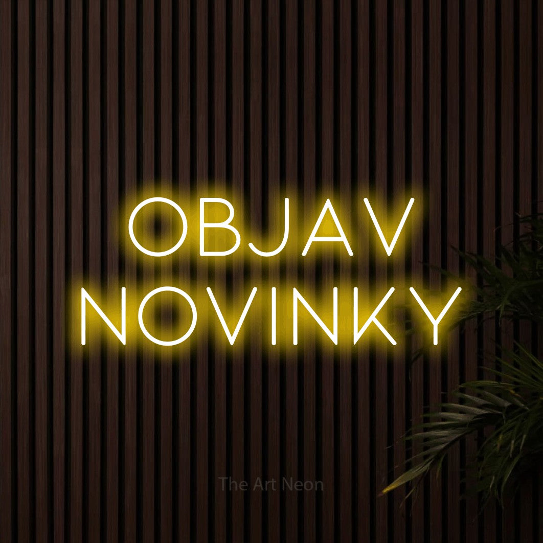 LED neon sign reading “objav NOVINKY”, arranged in two lines.