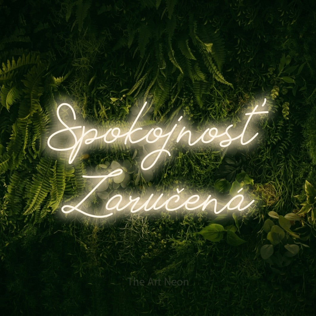 LED neon sign reading “Spokojnosť Zaručená”, arranged in two lines.