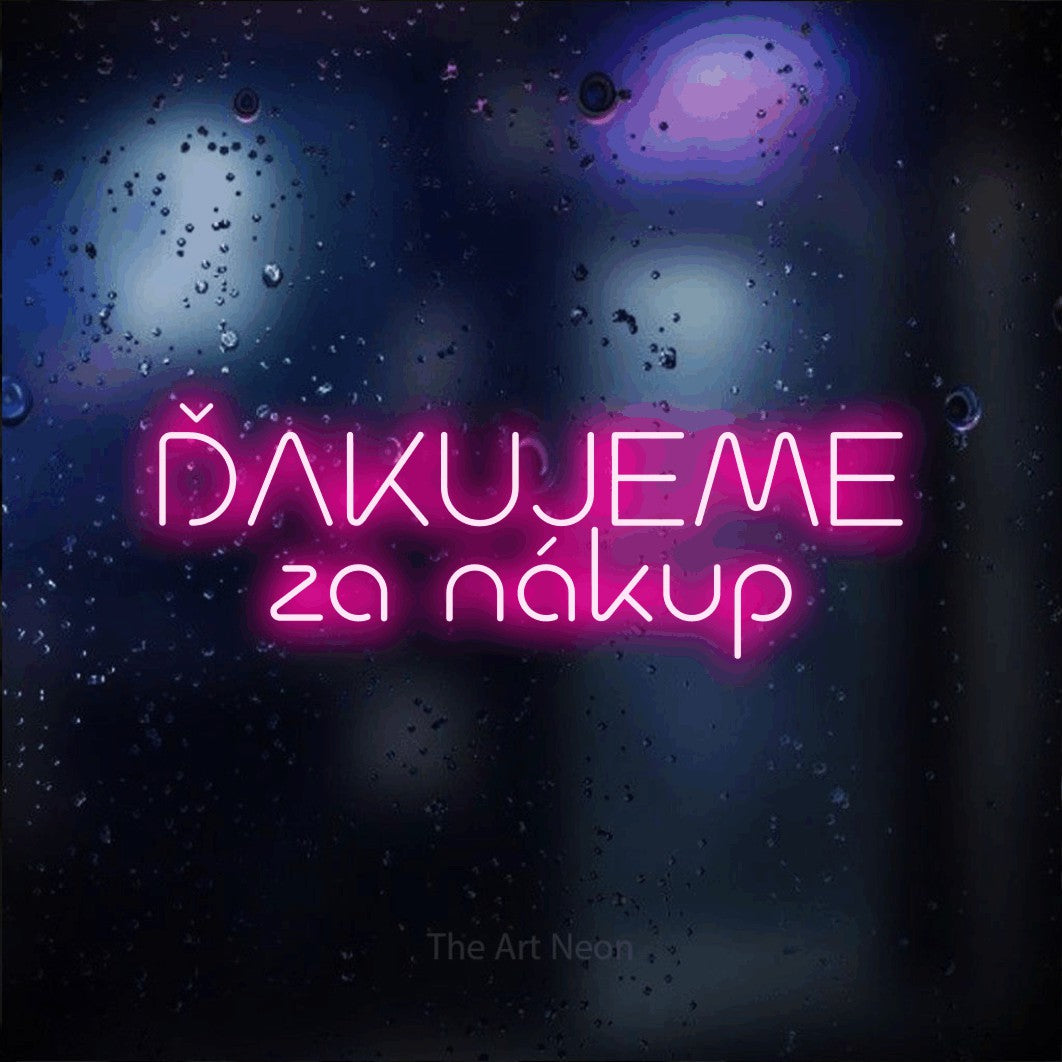 LED neon sign reading “ĎAKUJEME za nákup”, arranged in two lines.