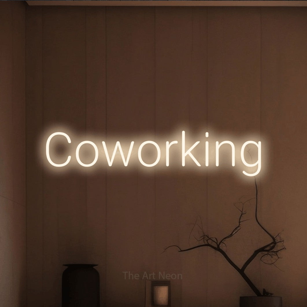 LED neon sign reading “Coworking”, arranged in a single line.