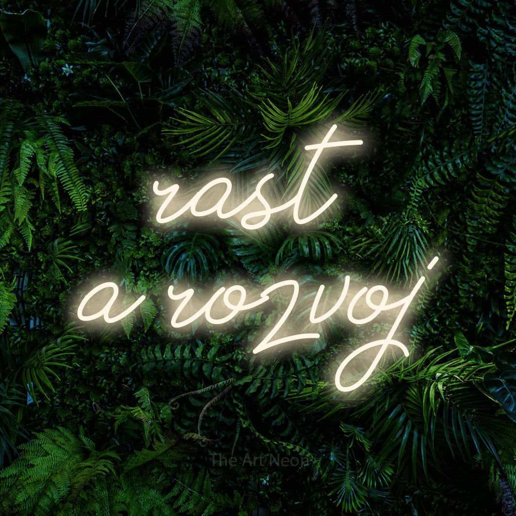 LED neon sign reading “rast a rozvoj”, arranged in two lines.