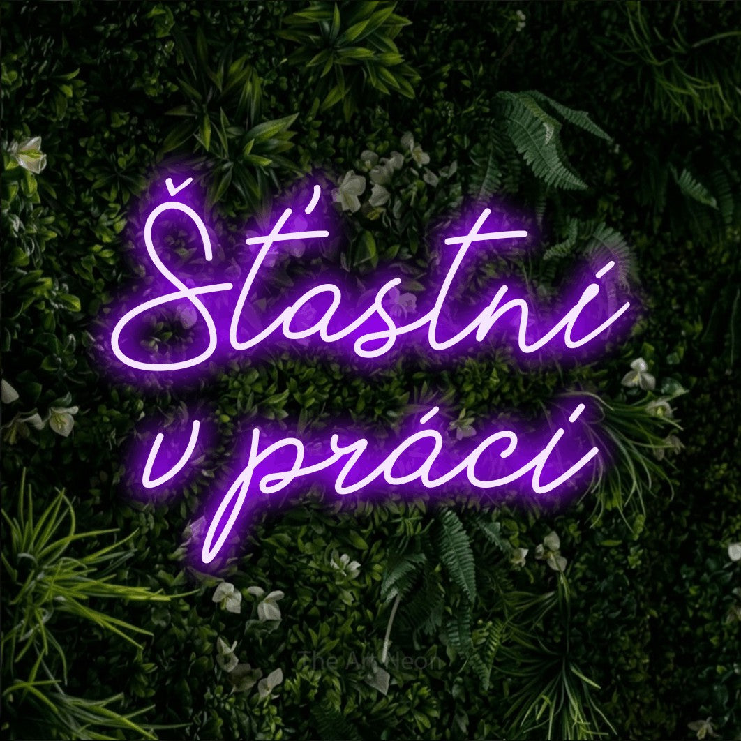 LED neon sign reading “Šťastní v práci”, arranged in two lines.