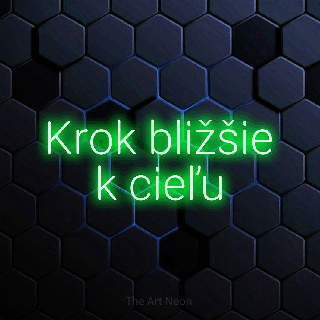 LED neon sign reading “Krok bližšie k cieľu”, arranged in two lines.