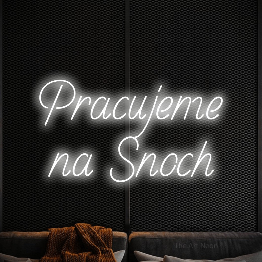 LED neon sign reading “Pracujeme na Snoch”, arranged in two lines.
