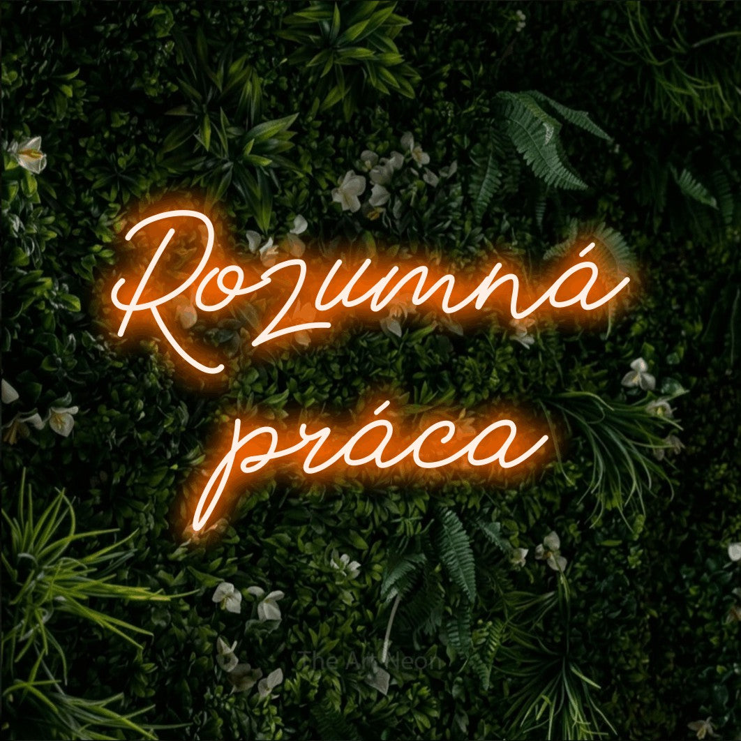 LED neon sign reading “Rozumná práca”, arranged in two lines.