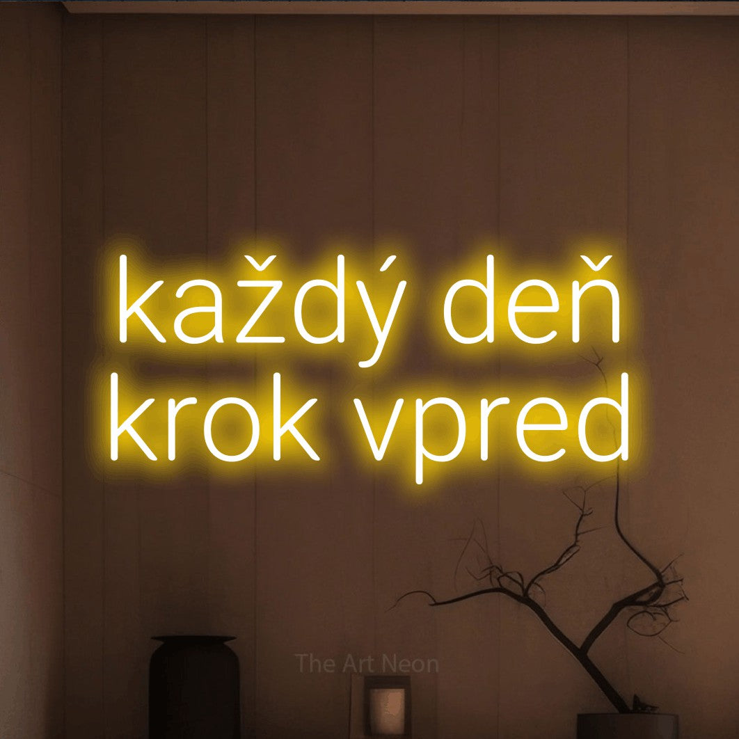 LED neon sign reading “každý deň krok vpred”, arranged in two lines.